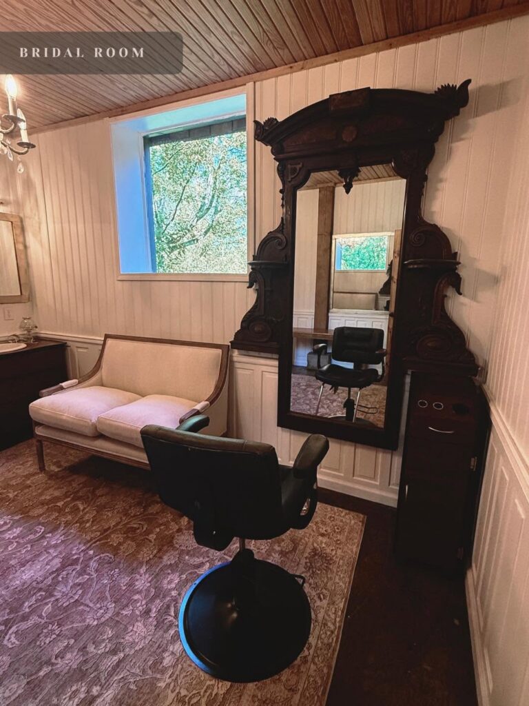Getting-ready suite with antique mirror, couch and salon chair